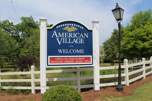 The America Village Welcome Sign