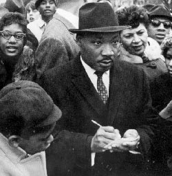 Picture of Martin Luther King signing an autograph