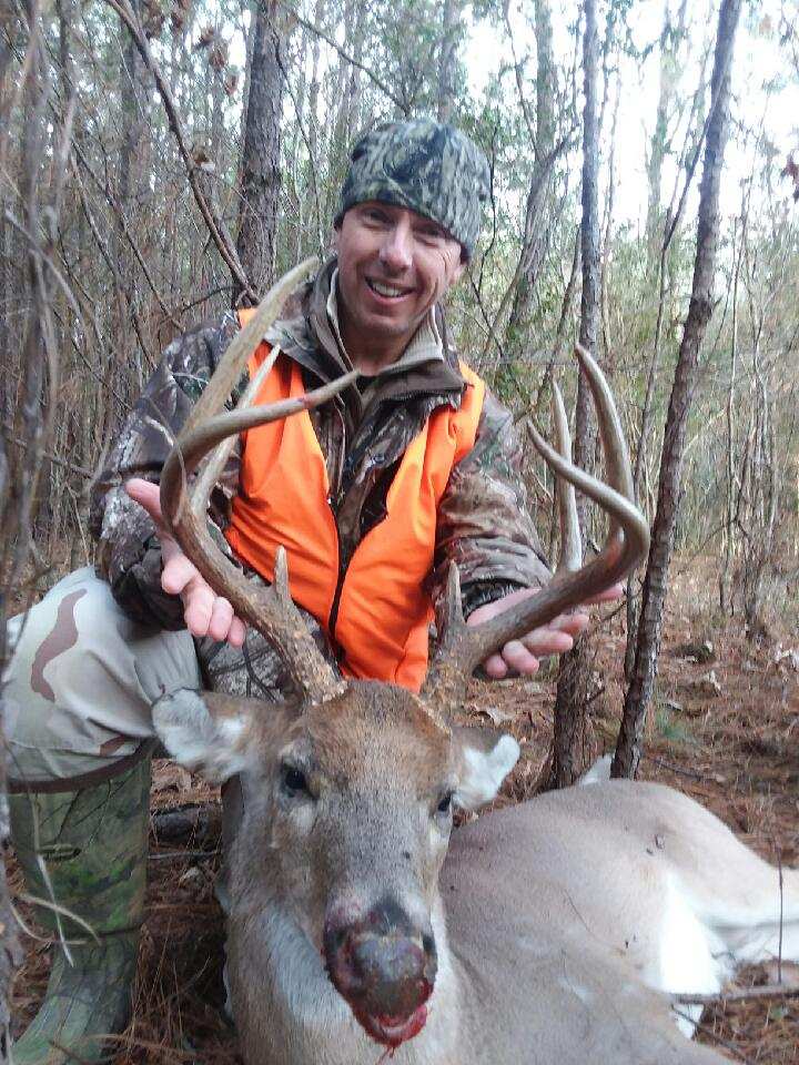 Deer Hunter with His Deer